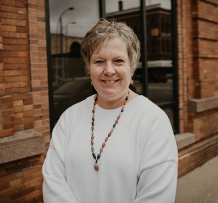 A Woman in Black Shirt Looking at the Pendulum Holding by the Woman in Black Clothes