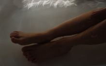 Person Lying on White Bed